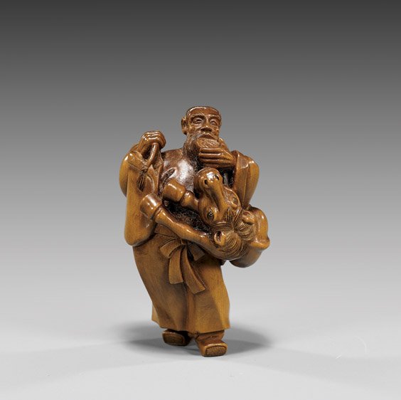 BOXWOOD NETSUKE BY HIDEYUKI: Chokaro Sennin: BOXWOOD NETSUKE BY HIDEYUKI: Chokaro Sennin Elaborately carved, boxwood netsuke of a Chokaro Sennin, standing and drinking from a cup, his magical horse wrapping around his waist, his gourd thrown ove