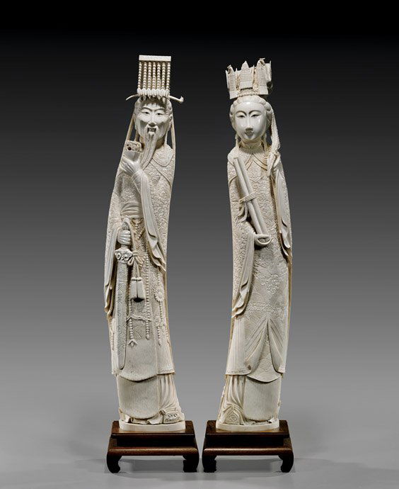 PAIR TALL CHINESE IVORY EMPEROR & EMPRESS: PAIR TALL CHINESE IVORY EMPEROR & EMPRESSLarge and well carved, pair of Chinese ivory figures; of an Emperor and Empress, each standing in ornately designed robes: he of dragon motif, holding a sword