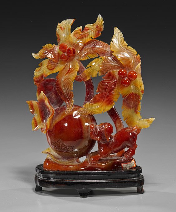 Chinese Carved Carnelian Agate Group: Chinese Carved Carnelian Agate Group Chinese carved carnelian agate group; depicting a large central orb, possibly a pomegranate, with flowers and palm trees, and with a dog crouching to one side, fin