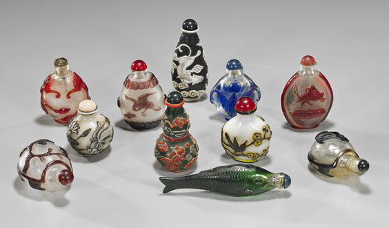 Group of 11 Carved Overlay Glass Snuff Bottles: Group of 11 Carved Overlay Glass Snuff BottlesGroup of 11 Chinese carved overlay Beijing glass snuff bottles: 2 with birds and flowers; fish form; turtle form with frog; cranes; 2 with fish; 2 with ba