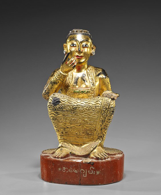 Antique Southeast Asian Carved Wood Figure: Antique Southeast Asian Carved Wood Figure Antique Southeast Asian carved wood Buddhist figure; gilt seated figure with knees close to chest, decorative "jeweled" robe, painted facial features and wri