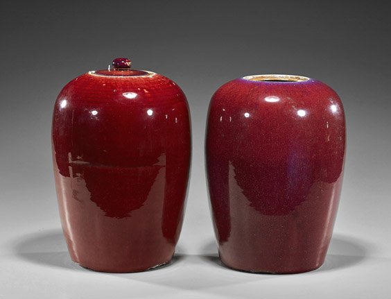 Pair Antique Chinese Oxblood Porcelain Jars: Pair Antique Chinese Oxblood Porcelain Jars Pair antique Chinese porcelain jars: each of somewhat globular form, with an oxblood glaze (typical chips to foot rims, one cover mismatched and one cover m
