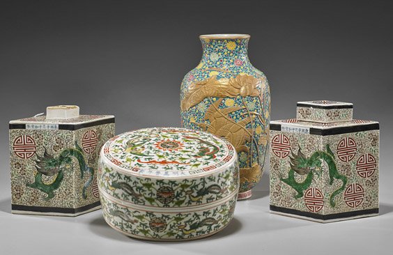 Group of Four Various Chinese Porcelains: Group of Four Various Chinese Porcelains Group of four Chinese porcelains: circular wucai box with dragons, phoenix and bats, 6-character mark on lid; Qianlong-style enameled floral vase with relief g