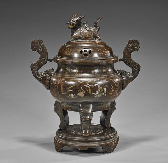 Unusual Large Antique Bronze Censer: Unusual Large Antique Bronze Censer Very unusual and rare, antique Chinese or Vietnamese bronze tripod censer; the inlaid figural scenes flanked by a pair of stylized animal handles and supported on t