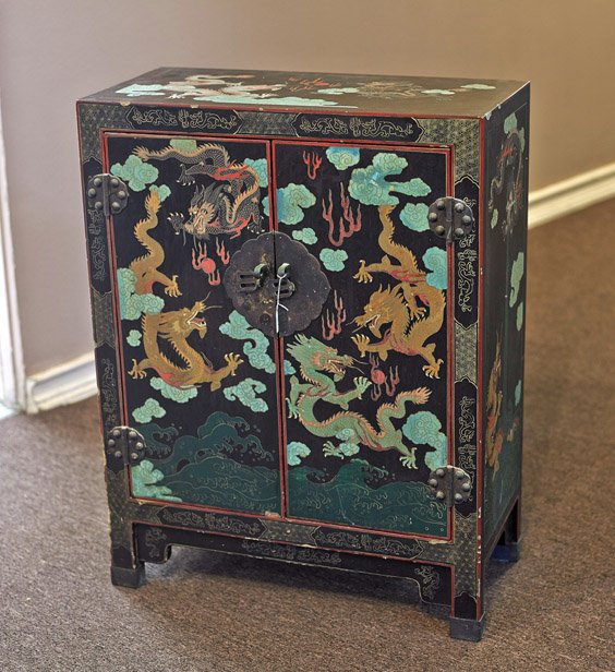 Chinese Lacquered Small Cabinet: Chinese Lacquered Small Cabinet Chinese lacquered small cabinet; with double doors to the front housing a single shelf, and with allover colorful design of writhing dragons among clouds chasing flamin