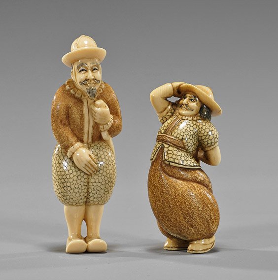 Two Old Carved Ivory Netsuke: Foreigners: Two Old Carved Ivory Netsuke: Foreigners Two old carved and realistically lacquered ivory netsuke; of foreigners (Dutch or Portuguese) each with sword, both signed