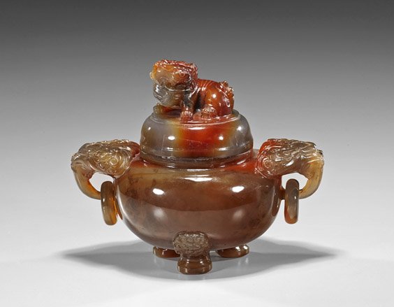 Chinese Carved Carnelian Agate and Jasper Censer: Chinese Carved Carnelian Agate and Jasper Censer Large and well carved highly translucent and richly colored Chinese carnelian agate and jasper censer; tripod form with matching cover, with lion mask 