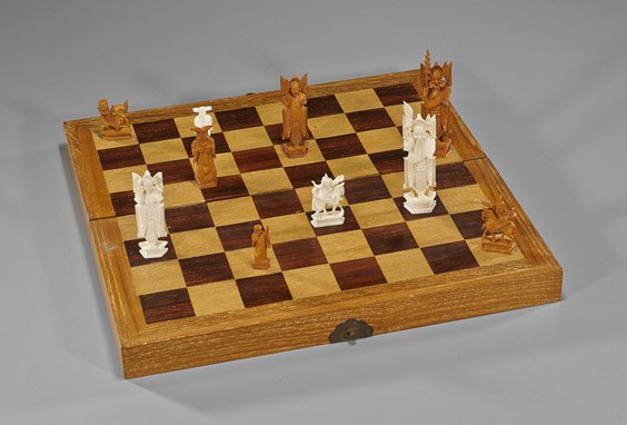 Old Chinese Ivory Chess Set in Box: Old Chinese Ivory Chess Set in BoxOld Chinese ivory chess set; thirty-two chess pieces (one half stained) of carved figural designs, in fitted board/box, mid-20th Century; L: 15 5/8"