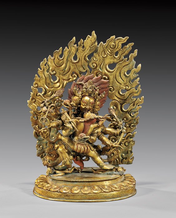 SINO-TIBETAN GILT BRONZE TANTRIC GROUP: 瑬金銅菩薩立像 SINO-TIBETAN GILT BRONZE TANTRIC GROUP Sino-Tibetan gilt bronze figural group; of the Buddhist deity Yellow Jambhala: with six arms holding att