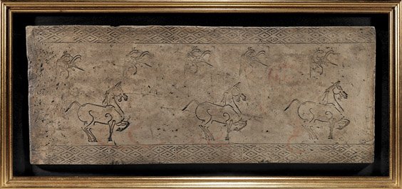 RARE HAN DYNASTY GRAY POTTERY TILE: 陶長方磚 RARE HAN DYNASTY GRAY POTTERY TILE Large and rare, Chinese Han Dynasty gray pottery architectural tile; the rectangular slab form depicting three prancing horses, with