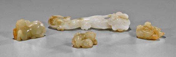 Group of Four Chinese Carved Jades: Group of Four Chinese Carved Jades Group of four Chinese carved jades, including: miniature whitish celadon ruyi scepter; Ming-style highly translucent recumbent pony; pale green and russet group of l