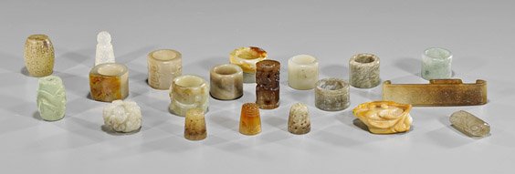 Twenty Carved Jades & Hardstones: Rings, Thimbles &: Twenty Carved Jades & Hardstones: Rings, Thimbles & Beads Group of twenty carved jade and hardstones, including: archer rings; archaistic beads; thimbles; buckle; dragon carving (usual wear); L: 4" (b