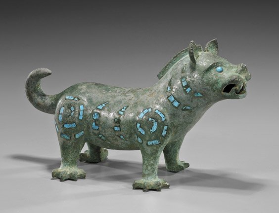Chinese Archaistic Bronze Model of a Dog: Chinese Archaistic Bronze Model of a Dog Unusual Chinese archaistic bronze model of a dog-like creature; standing alert, with turquoise inlays in Zhou/Warring States-style, heavily patinated and somew