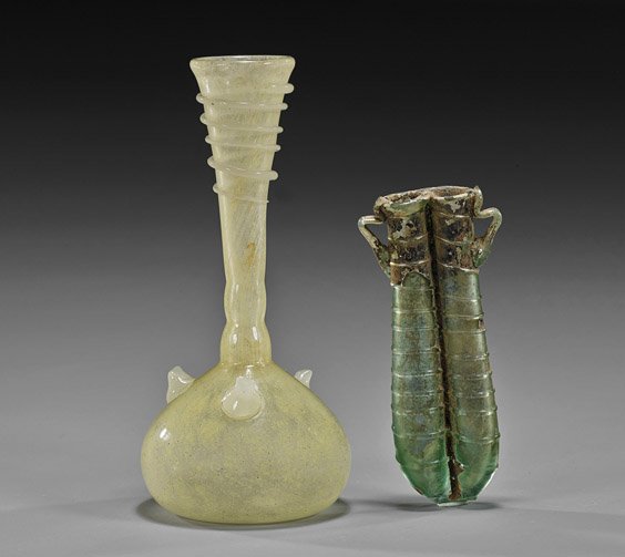 Two Antique Ancient-Style Glass Vessels: Two Antique Ancient-Style Glass Vessels Two antique glass vessels: ancient-style bottle vase, light yellow color with scrolling overlay to the neck; together with an ancient, probably Roman, double vi