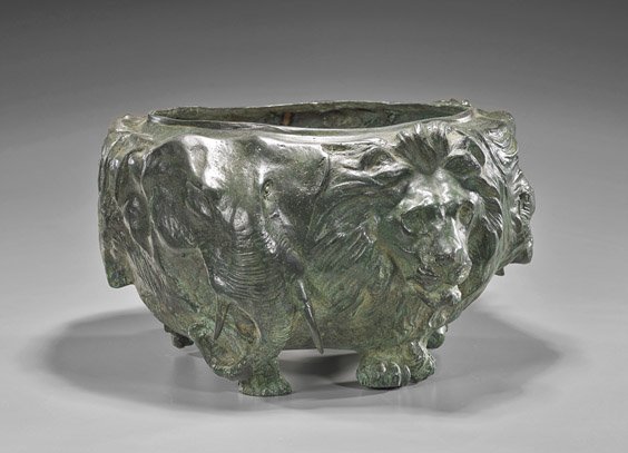 Well Cast Bronze Animal Bowl: Well Cast Bronze Animal Bowl Well cast and heavy bronze bowl; of circular form with moulded heads of many types of animals such as lions, elephants, deer, with their feet and trunks acting as six legs