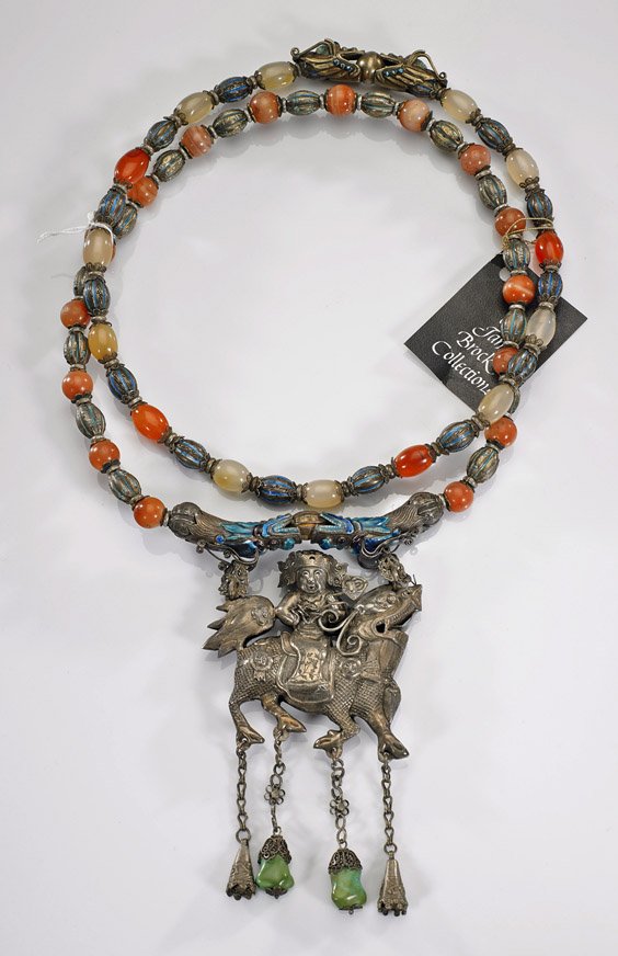 Two Bead Necklaces with Repoussé Silver Pendant:: Two Bead Necklaces with Repoussé Silver Pendant: Equestrian Two necklaces comprised of carved agate, carnelian and enameled silver beads; with antique Chinese repoussé silver pendant with figure rid