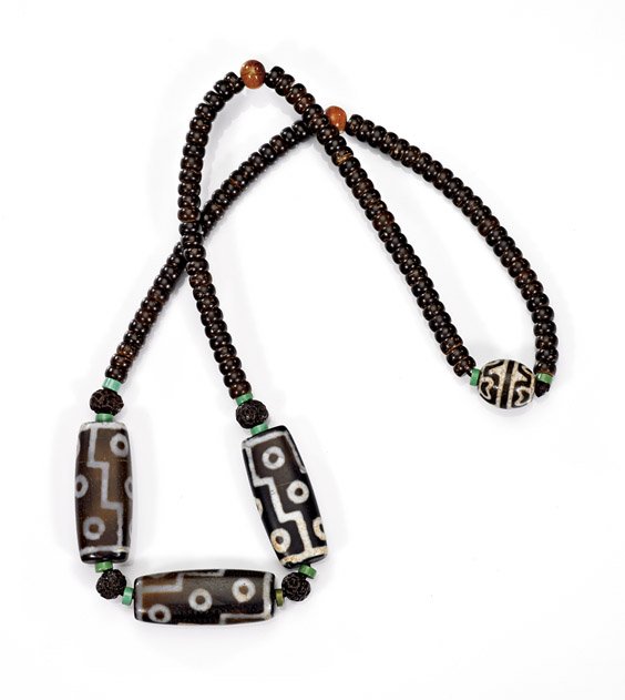 LARGE DZI-TYPE & COCONUT BEAD NECKLACE: 天珠項鍊 LARGE DZI-TYPE & COCONUT BEAD NECKLACE Buddhist necklace comprised of four Dzi-type beads: three of large flattened form and one round; together with coconut roundels 
