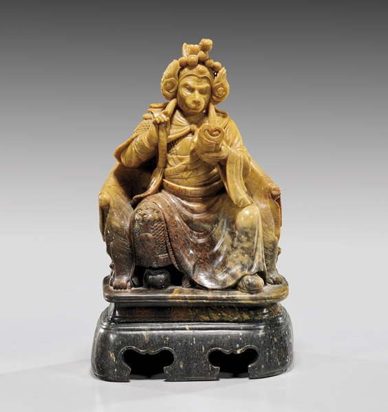 CARVED SOAPSTONE GROUP: Monkey King: 皂石雕美猴王 CARVED SOAPSTONE GROUP: Monkey King Chinese carved soapstone group; depicting the Monkey King dressed in formal armor with ornate headdress, seated upo