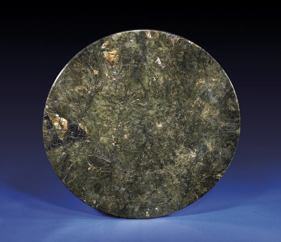 ROUND LABRADORITE TABLE TOP: ROUND LABRADORITE TABLE TOP Madagascar Large and highly aesthetic tabletop of circular form; fashioned from the comparatively rare feldspar mineral labradorite; a beautiful mélange of rich dark green