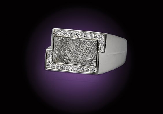 FINE METEORITE RING: FINE METEORITE RINGMuonionalusta - Iron, fine (IVA) octahedriteKiruna, Norrbotten, Northern SwedenThis dazzling ring would suit either a gentleman or a lady (approximately size 9), fashioned from ster