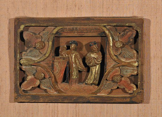 Chinese Polychrome Carved Wood Figural Panel: Chinese Polychrome Carved Wood Figural PanelPossibly from a Buddhist temple, Chinese polychrome carved wood panel; of rectangular form with two figures standing in heavy robes behind a window, framed
