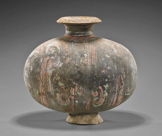 Han Dynasty Black Painted Pottery Cocoon Vase: Han Dynasty Black Painted Pottery Cocoon VaseChinese Han Dynasty painted black pottery cocoon vase; of oblong form with an everted rim and foot, decorated with swirls in shades of pink, white and red