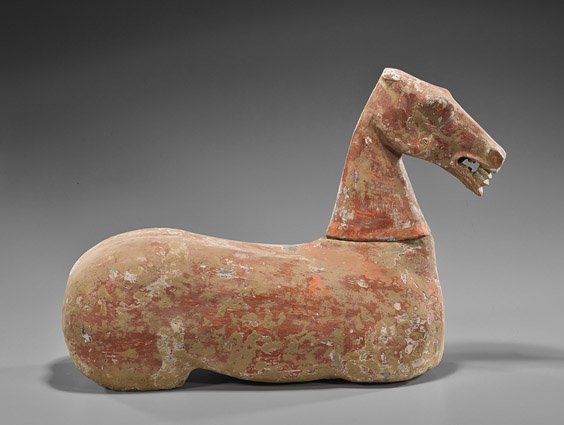 Han Dynasty Red Painted Pottery Horse: Han Dynasty Red Painted Pottery Horse Han Dynasty red painted pottery model of a horse: the detached head with worn features and its mouth open holding something in teeth, concentric bands around the 
