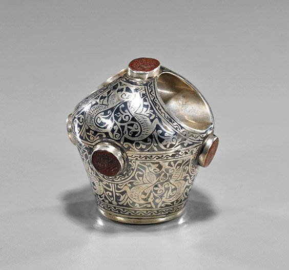 Early Indian Intaglio-Set Ring/Seal: Early Indian Intaglio-Set Ring/SealEarly Indian silver or silvered ring and seal; set with five carved intaglio seals, niello floral decoration, and Ganesha on bottom (some wear); H: 3"