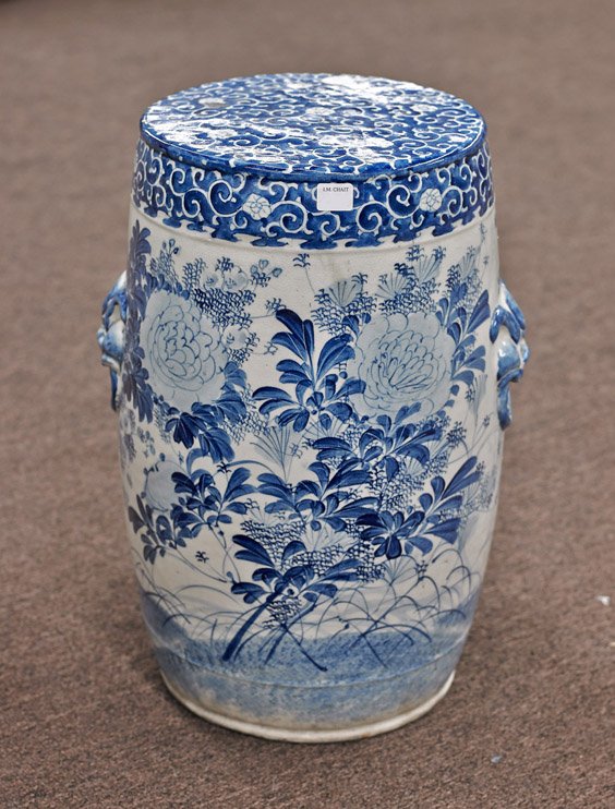 Blue and White Porcelain Garden Seat: Blue and White Porcelain Garden Seat Blue and white porcelain pedestal/garden seat; in Chinese-style, the slim drum form with design of dense foliate garden scene, with two moulded lion head faux-ring