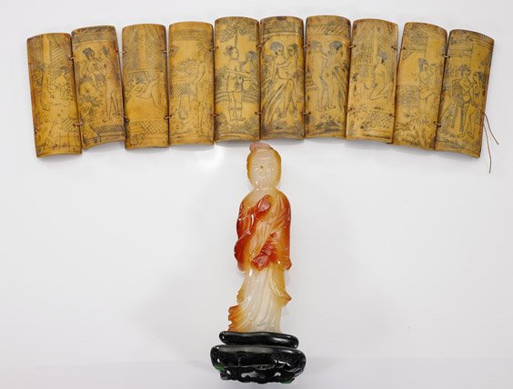 Two Chinese Items: Agate Lady & Bone "Book": Two Chinese Items: Agate Lady & Bone "Book" Two Chinese items, including: carved agate figure of a standing lady, with some natural inclusions; together with ten-panel bone "book" with erotic scenes (