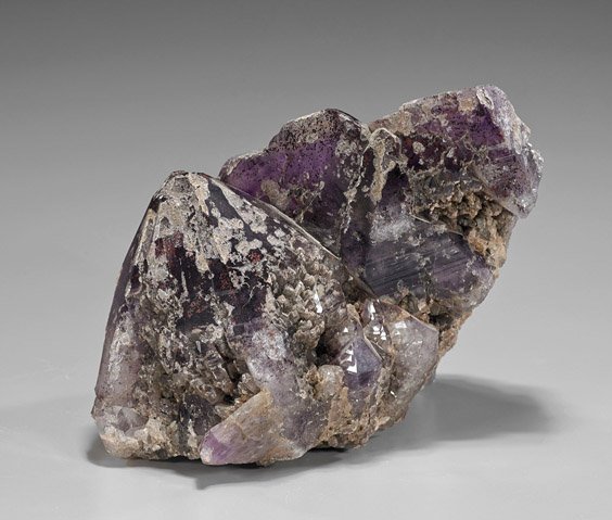Natural Amethyst Cluster: Natural Amethyst Cluster Amethyst mineral cluster; of natural form displaying soft grey to purple coloration, with one large point termination and some smooth facets (as-is); L: 8"