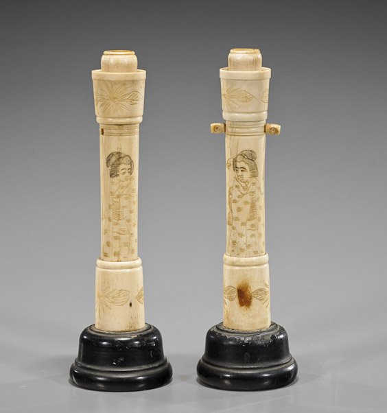 Pair Japanese Carved Bone Candlesticks: Pair Japanese Carved Bone CandlesticksPair of Japanese carved bone candlesticks; sectional with cylindrical shaft, depicting a mirror image of an older geisha looking over her shoulder, band of flower