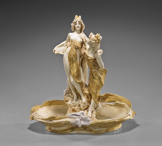 Royal Dux Art Nouveau Porcelain Figural Group: Royal Dux Art Nouveau Porcelain Figural Group Old Royal Dux Bohemia Art Nouveau gilt and polychrome porcelain figural group; of a draped maiden and friend standing in front of a fountain, flanked by p