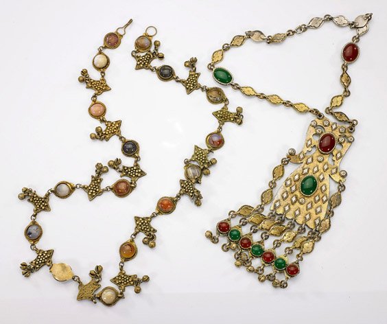 Two Stone & Glass-Set Metal Necklaces: Two Stone & Glass-Set Metal NecklacesTwo metal necklaces; each set with various agate, stone and glass cabochons with stylized metal beads and each with attached "bells" (wear and use); L: 34" (longer
