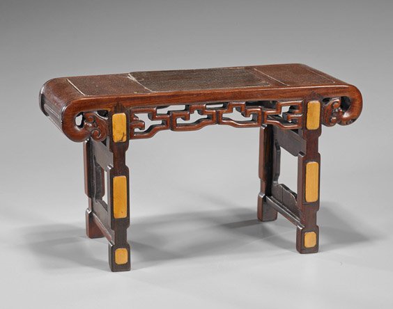 Miniature Carved Hardwood Altar Table: Miniature Carved Hardwood Altar Table Miniature Chinese carved hardwood altar table; the rectangular top with curved, scroll ends terminating in ruyi heads, openwork aprons, the two supports with shap
