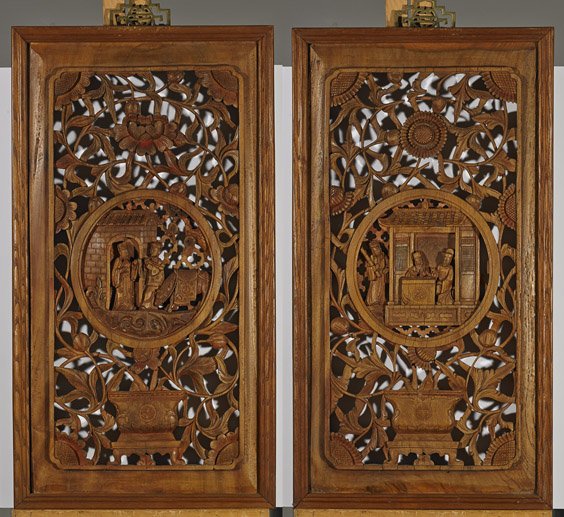 Pair Chinese Carved Wood Window Panels: Pair Chinese Carved Wood Window PanelsPair of Chinese carved wood window panels; each depicting a center figural medallion, surrounded by scrolling flowers from a planter at base, with Shou medallion,