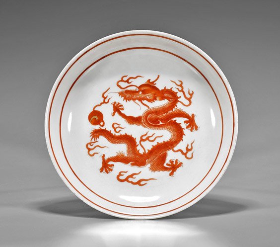 Chinese Coral Red Dragon Porcelain Dish: Chinese Coral Red Dragon Porcelain Dish Chinese coral red glazed porcelain dish; of circular form with writhing dragon amid clouds reaching for the flaming pearl, seal mark (frits to rim, some wear); 