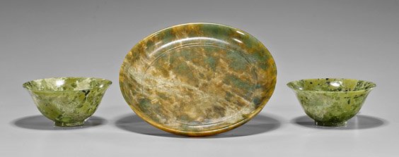 Three Chinese Carvings: Dish & Bowls: Three Chinese Carvings: Dish & BowlsGroup of three Chinese carvings: hardstone dish of circular form with slight raised foot; together with pair bowenite bowls of circular form with flaring lip; each