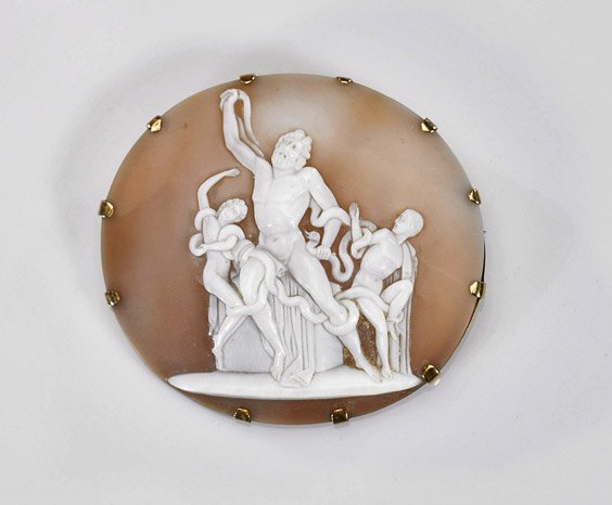 Antique Carved Cameo Shell Brooch of Laocoön & Sons: Antique Carved Cameo Shell Brooch of Laocoön & Sons Antique carved cameo shell brooch; depicting the Trojan prince Laocoön and his sons coiled in snakes; set in 18K yellow gold (some wear); D: 2 1/2