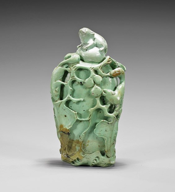 Carved Turquoise-Like Snuff Bottle: Carved Turquoise-Like Snuff Bottle Carved turquoise-like snuff bottle; of flattened ovoid form with squirrel and peach motif in relief, matching stopper with squirrel finial (broken spoon), natural in