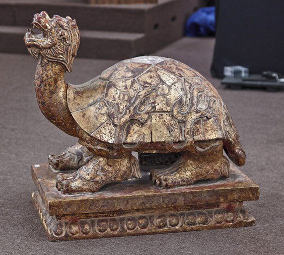 Chinese Gilt & Lacquered Wood Dragon Turtle: Chinese Gilt & Lacquered Wood Dragon TurtleChinese gilt and lacquered wood model; in the form of a dragon turtle, flame detailing on shell atop rectangular lotus base (usual wear and cracks); L: 35"