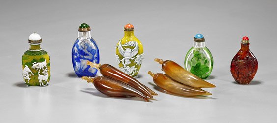 Seven Carved Snuff Bottles: Hardstone, Glass & Amber: Seven Carved Snuff Bottles: Hardstone, Glass & Amber Group of seven Chinese carved snuff bottles: pair triple pepper hardstone; two yellow ground with white and green overlay, of spade and rectangular