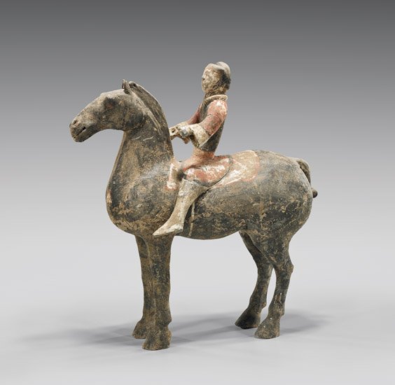 HAN DYNASTY PAINTED POTTERY HORSE & RIDER: 陶加彩騎馬俑 HAN DYNASTY PAINTED POTTERY HORSE & RIDER Chinese Han Dynasty painted pottery horse and rider; of a male groom riding a plump black horse standing four