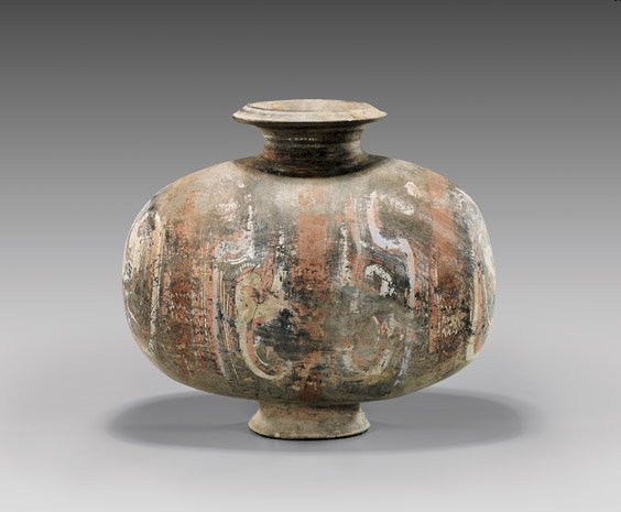 HAN DYNASTY POTTERY COCOON JAR: 陶加彩繭形罐 HAN DYNASTY POTTERY COCOON JAR Chinese Han Dynasty painted pottery cocoon jar; with remains of brightly pigmented geometric designs; the egg-form with 