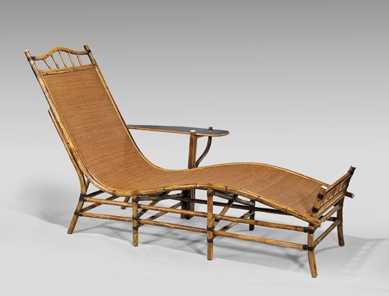CHINESE BAMBOO CHAISE LOUNGE: 竹編躺椅 CHINESE BAMBOO CHAISE LOUNGEChinese bamboo chaise lounge; the woven seat of serpentine form set on eight legs, with a small lacquered tabletop attached to one side; L:
