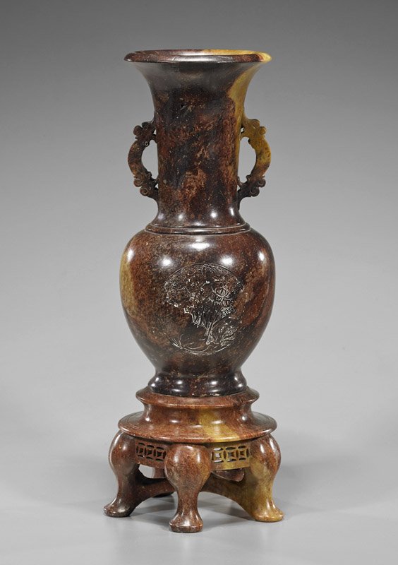 Chinese Carved Soapstone Vase & Stand: Chinese Carved Soapstone Vase & Stand Chinese carved soapstone vase; of circular form and tall flared neck, a roundel of a lotus patch to each sides; set atop five-legged pedestal with openwork apron 