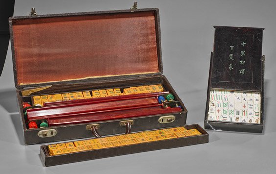 Two Chinese Mahjong Playing Sets: Two Chinese Mahjong Playing Sets Two Chinese mahjong sets in cases with incised and polychromed tiles with western numbers: one with celluloid and bamboo tiles with chips and dice, set in a wood box w