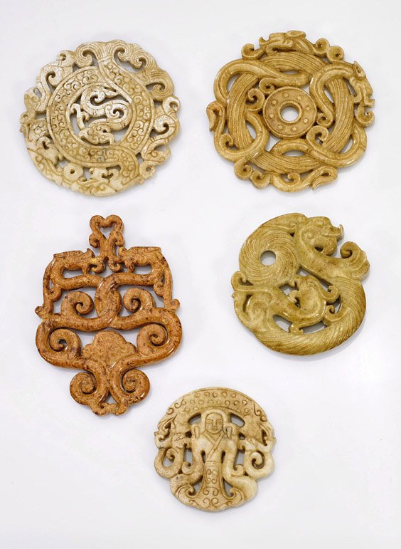 Five Chinese Archaistic Carved Jade/Hardstones: Five Chinese Archaistic Carved Jade/Hardstones Group of five Chinese archaistic carved jade/hardstone openwork plaques: three circular form depicting writhing dragons; square form with foliate termina