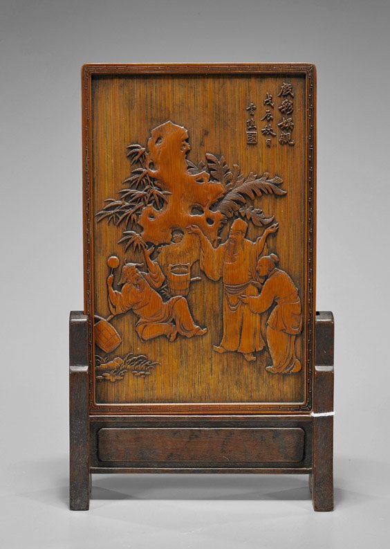 Chinese Carved Bamboo Tablescreen: Chinese Carved Bamboo Tablescreen Chinese carved bamboo tablescreen; of rectangular form with scholars talking amid pine, palm and scholar rock; inscription and seal mark; set in a wood frame; 7 1/2" 