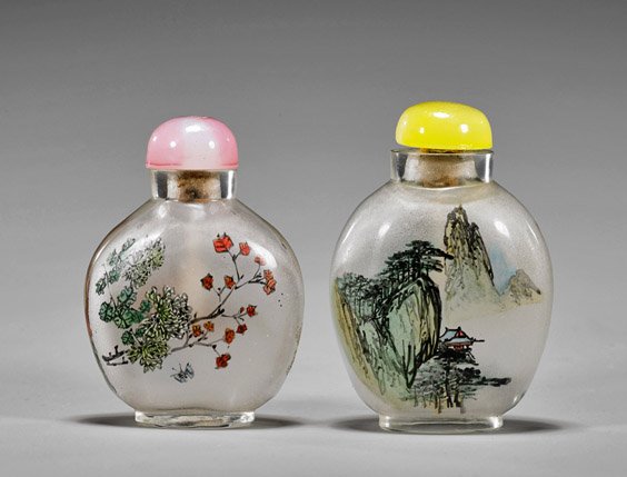 Two Inside-Painted Glass Snuff Bottles: Two Inside-Painted Glass Snuff Bottles Two well hollowed, inside-painted glass snuff bottles: of oval form with raised base, a continuous landscape scene decorates each side; together with circular fo